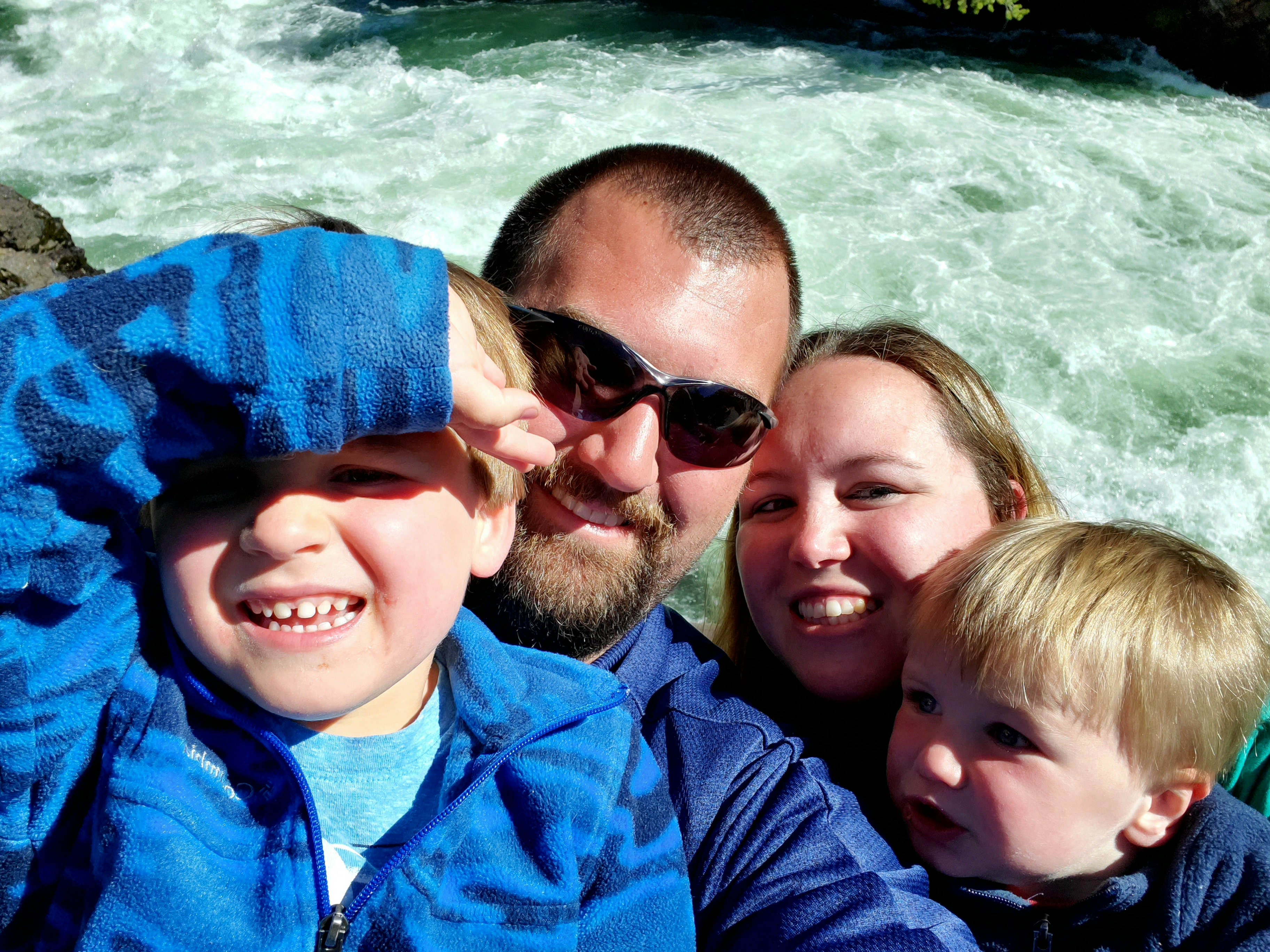 Family photo from the Brink of the Upper Falls Hiking Trail